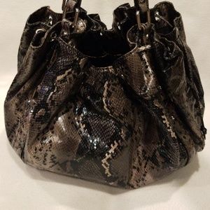 Drawstring snakeprint bag.